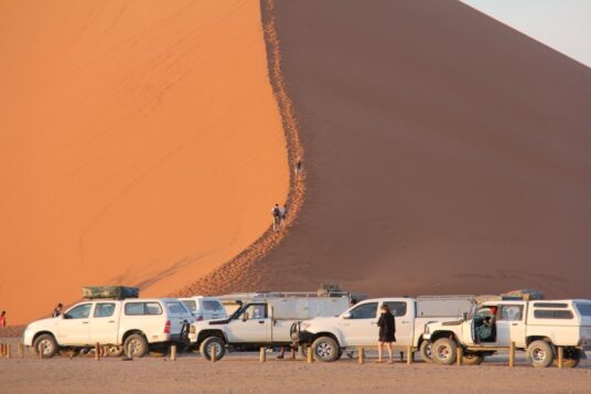 Cars at the base of dune 45
