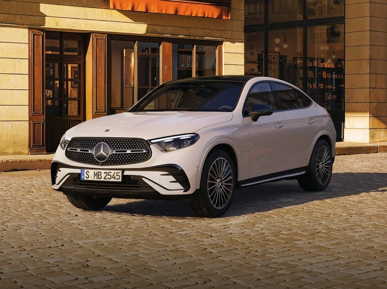 Mercedes-Benz GLC Coupe parked on a cobblestone street, highlighting the elegant "couturier suit" styling of this versatile luxury soft-roader