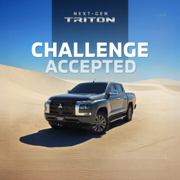 A Mitsubishi Next-Gen Triton overlanding on the desert dunes.
