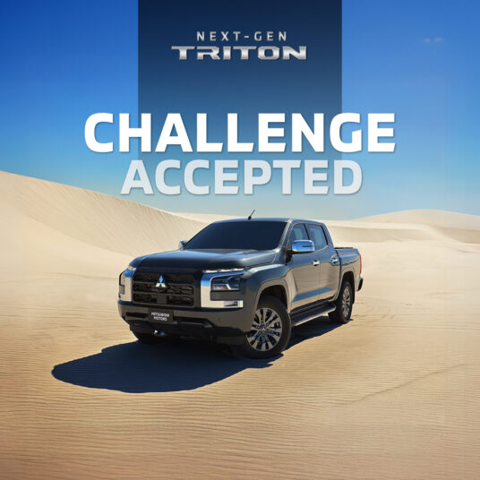 A Mitsubishi Next-Gen Triton overlanding on the desert dunes.