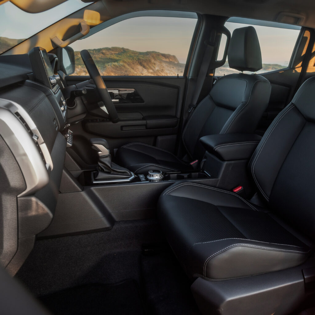 The comfortable and innovative inside of the Mitsubishi Next-Gen Triton. Showing plush leather seats, the modern interior and inside cabin. 