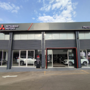 Exterior view of the CMH Mitsubishi Motors Menlyn car dealership showroom.