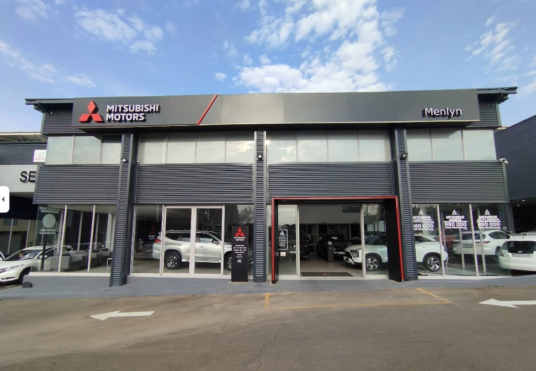 Exterior view of the CMH Mitsubishi Motors Menlyn car dealership showroom.