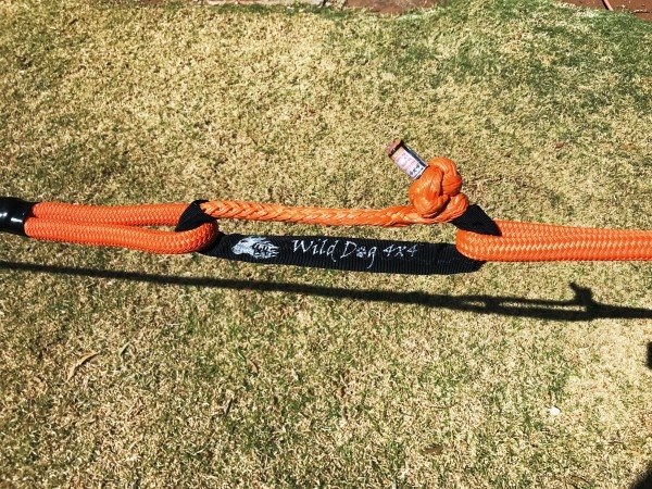 A soft shackle joins two tow ropes. Note the protective sleeve. A soft shackle joins two tow ropes. Note the protective sleeve.